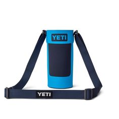 the yeti water bottle is attached to a strap and it's blue with black lettering