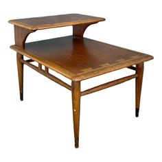 a small wooden table with an open shelf on the top and one drawer at the bottom