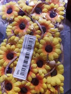 sunflowers are wrapped in plastic and ready to be sold