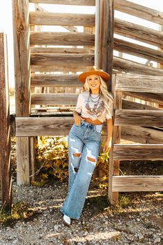 A cowgirl can never have too many pairs of jeans! These High Waisted Wide Leg Distressed Jean have rips in all the right places. Get ready to layer on your favorite graphic tee and shacket to complete the ultimate boho chic fit! Medium Wash Cowboy Boho Outfit, Festival Outfits Western, Cute Western Outfits Women, Cowgirl Style Outfits Rodeo, Western Style Outfits Cowgirl Chic, Western Concert Outfit, Western Chic Outfits, Western Pics, Texas Outfits