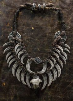 Crafted for the daring and unique, this neck jewelry embodies a fusion of Bohemian style and post-apocalyptic vibes. Perfect for shaman costumes, LARP products, and festival decorations, it features fangs and bird skulls for an edgy touch. This double necklace adorned with a ring necklace is a must-have for horror lovers looking to make a bold statement with their accessories. A distinctive piece that sets you apart from the crowd. ❗️DETALIS❗️ Our products are meticulously crafted by skilled art Ork Costume, Shaman Costume, Larp Accessories, Medicine Seller, Bird Skulls, Post Apocalyptic Costume, Neck Jewelry, Double Necklace, Horror Lovers