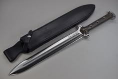 a knife and sheath sitting next to each other