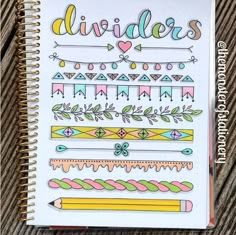 an open notebook with doodles on it and the words dividers written in cursive