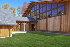 a large wooden building with lots of windows