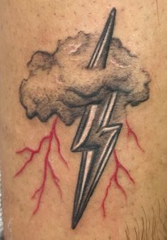 a man with a lightning tattoo on his arm and chest is shown in this photo