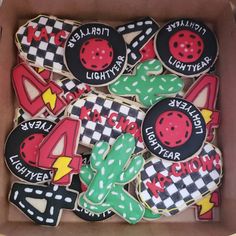 some decorated cookies in a box on a table