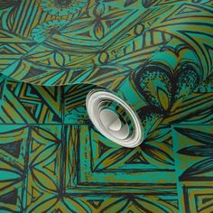 a green and black wallpaper with an abstract design on it's side, next to a roll of tape