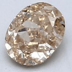 an oval shaped diamond on a white surface