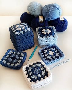 four crocheted grannys are sitting on a table