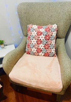 a chair with a pillow on top of it