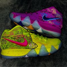 a pair of nike basketball shoes with graffiti on them