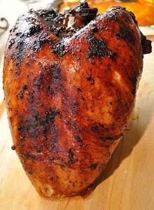 a close up of a chicken on a cutting board