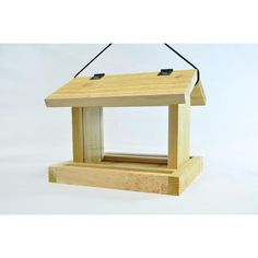 a small wooden bird house on a white background