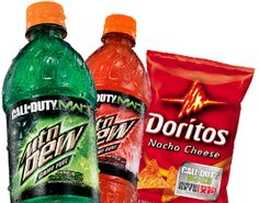 three bottles of soda, one with orange and one with green on the side that says doritos next to each other