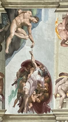 the creation of adam and eve painted on the ceiling