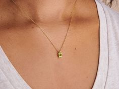 A dainty stone and delicate metallic chain are combined to create this Gold Pendant Necklace in bright peridot, your new favorite wear-anywhere accessory. Peridot is the birthstone of August.