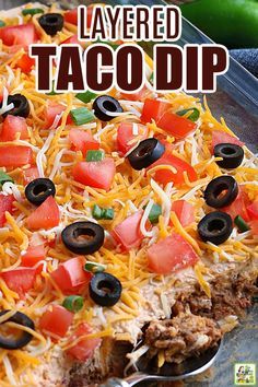 this layered taco dip is ready to be eaten