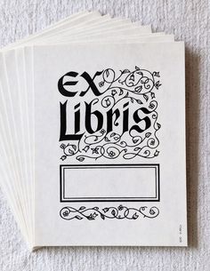 six white envelopes with the words ex libris printed on them, all in black ink