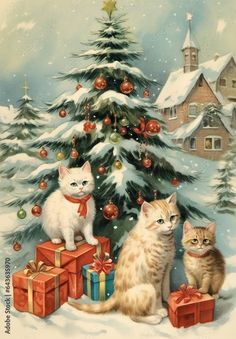 two cats sitting in front of a christmas tree with presents on the ground and one cat standing next to it