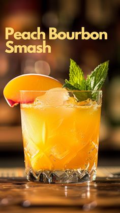 the peach bourbon smash cocktail is garnished with mint