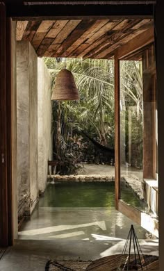 the inside of a house with an outdoor pool