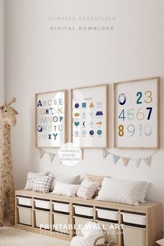 a baby's room with white walls and pictures on the wall