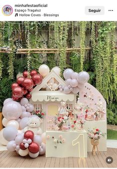 an outdoor party with balloons, cake and decorations