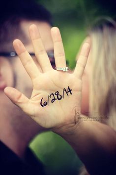 a man and woman holding up their hands with the word goth written on them in black ink