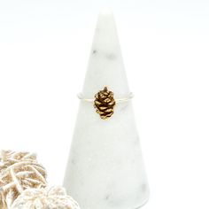 This adorable little pine cone was cast from a natural tiny pine cone I found on a nature walk. It sits on a comfortable 1mm thin band. Adorable alone or stacked with friends! Select between Bronze or Sterling Silver pine cones. Both options sit on a .925 sterling silver ring band. Each tiny pine cone is hand pressed into a mold, cut and shaped using metal clay and then kiln fired and finished to this adorable solid metal embellishment and then fabricated into a ring. As with any handcrafted ite Silver Ring Band, Nature Walk, Sterling Silver Rings Bands, Nature Inspired Jewelry, Silver Band Ring, Metal Clay, Pine Cone, Walking In Nature, Ring Band