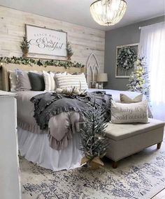 a bed room with a neatly made bed and christmas decorations