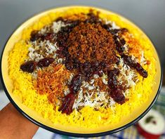 a yellow plate topped with lots of different types of food