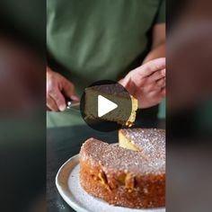 a person cutting into a cake with a knife