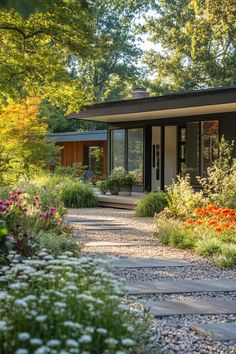 a small house surrounded by flowers and trees