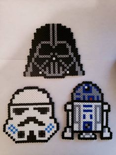 lego star wars characters made out of black and white beads, including darth vader and r2d2