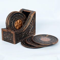 a set of three decorative wooden coasters