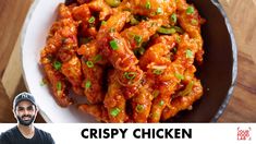 a man is smiling next to a plate of food with the words crispy chicken on it