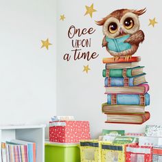 an owl sitting on top of a stack of books with the words once upon a time above it