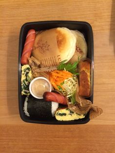 a black container filled with different types of food