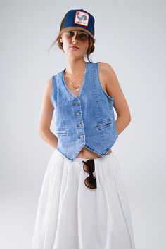 The Fitted Denim Vest is a staple piece for any wardrobe, providing versatility and style. Made from high-quality denim, it offers durability and comfort. With its timeless design, it can be dressed up or down for any occasion. Add it to your collection today. 4 button front closure Decorative pockets V-neck Faux welt pockets Material Cotton elastane blend Machine washable Classic Washed Denim Top For Spring, Spring Relaxed Fit Denim Top With Snap Buttons, Spring Washed Denim Vest For Workwear, Relaxed Fit Denim Top With Button Closure For Spring, Spring Washed Denim Vest For Work, Casual Cotton Jeans With Snap Buttons, Light Wash Denim Top With Buttoned Pockets For Spring, Washed Blue Button-up Denim Vest For Summer, Spring Denim Top With Buttoned Pockets In Medium Wash