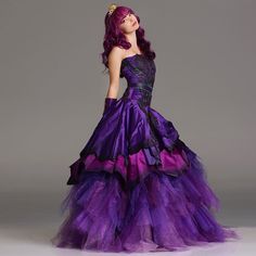 a woman in a purple and black dress