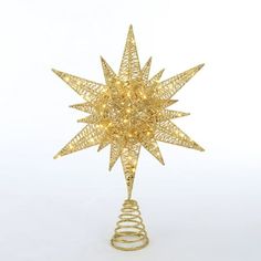 a gold christmas tree topper with lights on it's sides and a spiral wire base