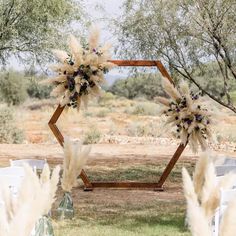 an outdoor ceremony set up with pamodia flowers