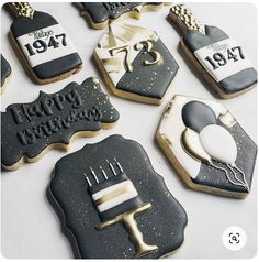 decorated cookies with black icing and white frosting