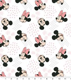 a mickey mouse pattern with pink bows on it's head and polka dots in the background