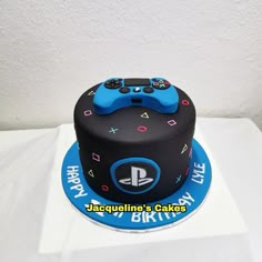 a birthday cake with a video game controller on top