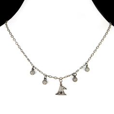 A cute little witch hat plated in gun-metal and encrusted with cubic zirconia is the centerpiece in this darling 18" necklace.  It is surrounded by little cubic zirconia encrusted gunmetal plated balls, two on each side for additional sparkle.  This composition gracefully dangles from a robust yet delicate gunmetal finished chain and secures with a round ball magnetic clasp in gunmetal adorned with sparkling cubic zirconias. For individuals who find dealing with small clasps challenging, the magnetic clasp ensures effortless slipping into and removing the necklace.  All metal used is zinc oxide with a gunmetal finish and contains no harmful ingredients. Each necklace arrives elegantly in a windowed box. Cz Necklace, Witchy Woman, Magnetic Clasp, Witch Hat, Pendant Necklaces, Jewelry Necklace Pendant, Cubic Zirconia, Witch, Bathing Beauties