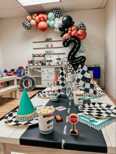 a birthday party with black and white decorations