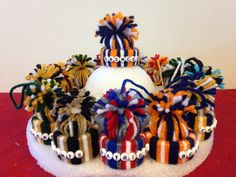 there is a cake decorated with many colorful decorations on it's top and sides