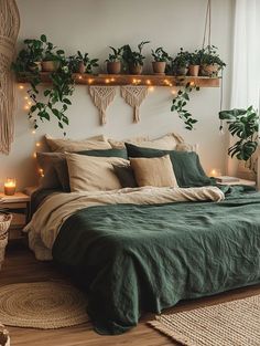 a bed with green sheets, pillows and plants on the headboard above it is surrounded by string lights