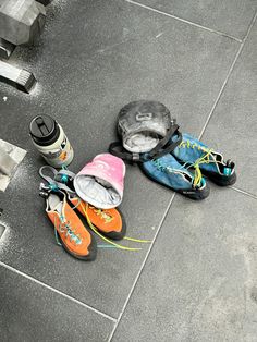 several pairs of shoes are laying on the ground